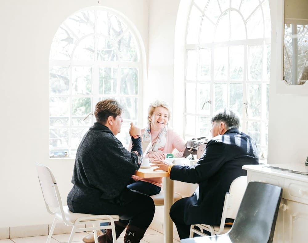 People sharing a meal and conversation around a table